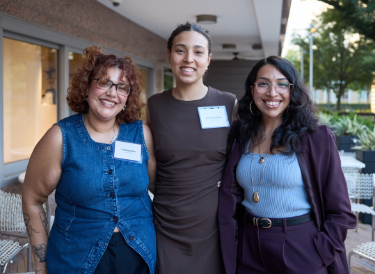 Three Bottom Line team members at an event.